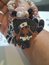 Load image into Gallery viewer, Nurse in brown and black
